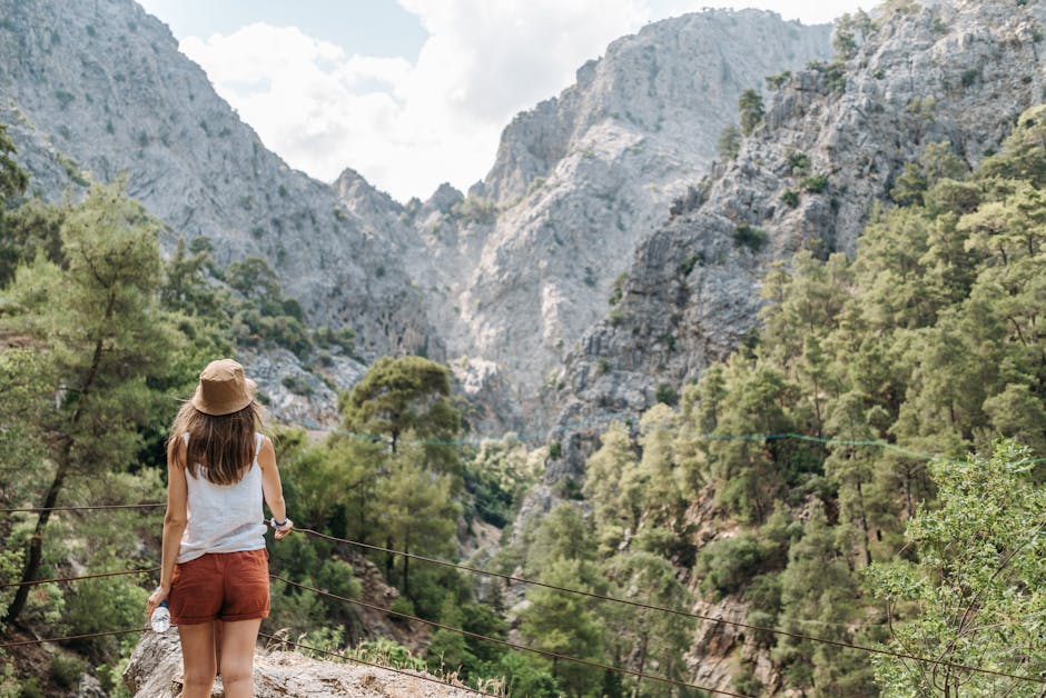 Woman enjoying nature on a hike with stunning mountain views