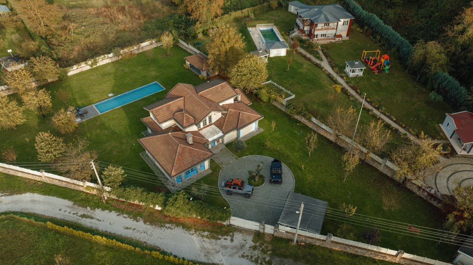 Aerial shot of suburban houses with pools in İzmit, Kocaeli, Türkiye, showcasing spacious lawns